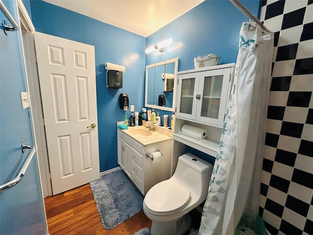 bathroom featuring vanity, hardwood / wood-style floors, curtained shower, and toilet