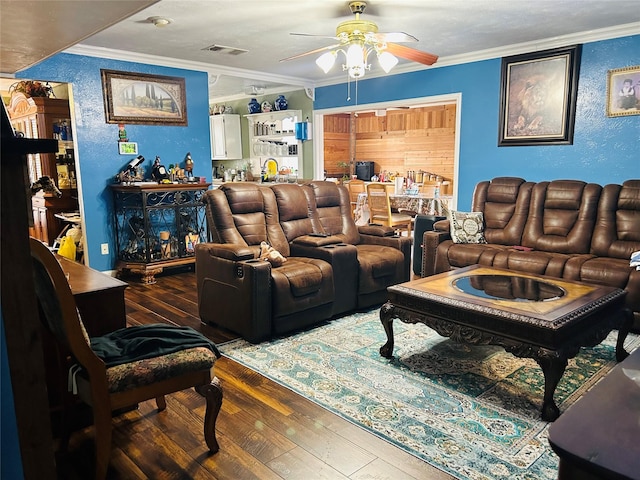 living room with crown molding, ceiling fan, and hardwood / wood-style floors