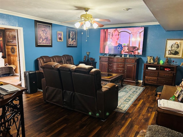 living room featuring crown molding, ceiling fan, and dark wood-type flooring