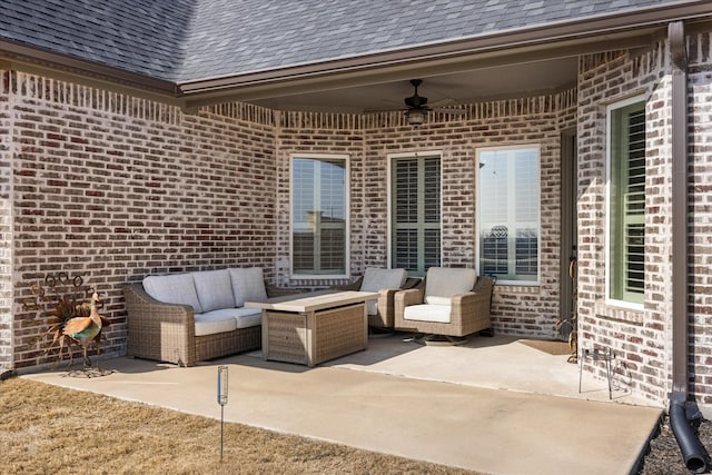 view of patio / terrace with a ceiling fan and an outdoor living space