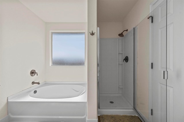 bathroom featuring plus walk in shower