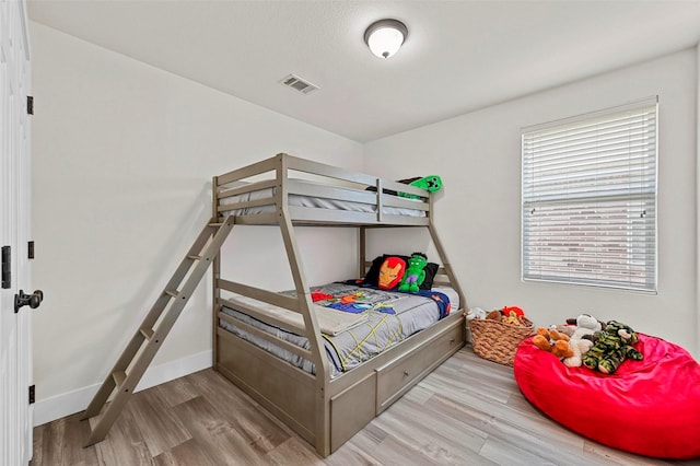 bedroom with hardwood / wood-style floors