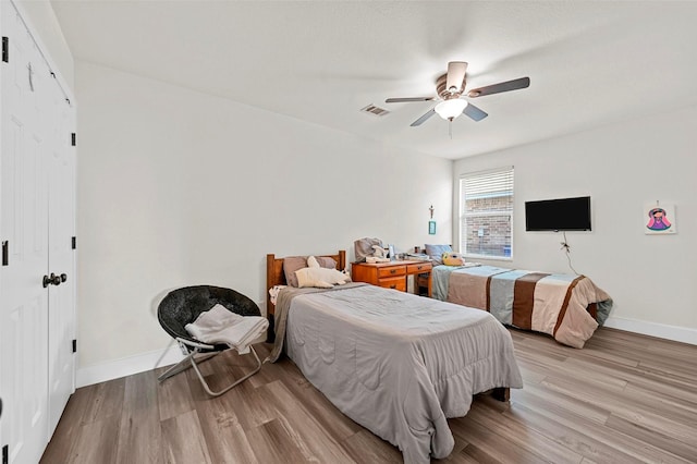 bedroom featuring ceiling fan and light wood-type flooring