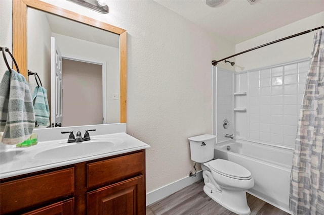 full bathroom featuring shower / tub combo, vanity, wood-type flooring, and toilet