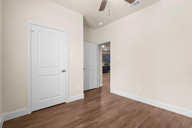 unfurnished bedroom featuring hardwood / wood-style flooring and ceiling fan