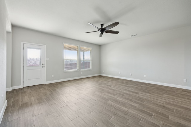 spare room featuring ceiling fan and light wood-type flooring