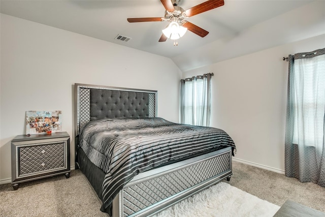 bedroom featuring ceiling fan, light colored carpet, and lofted ceiling