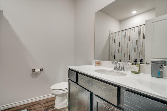 bathroom with vanity, wood-type flooring, toilet, and a shower with shower curtain