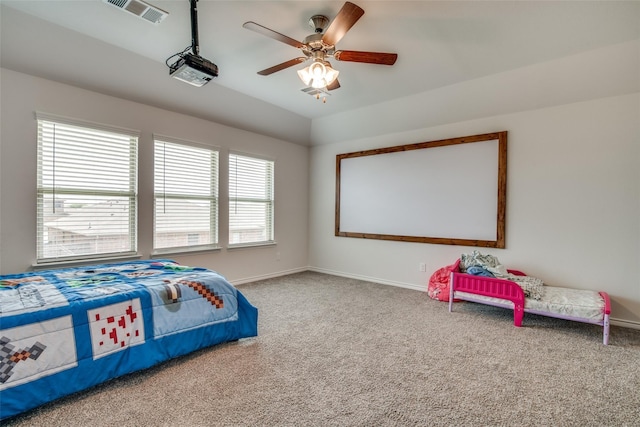 bedroom with lofted ceiling, ceiling fan, and carpet flooring
