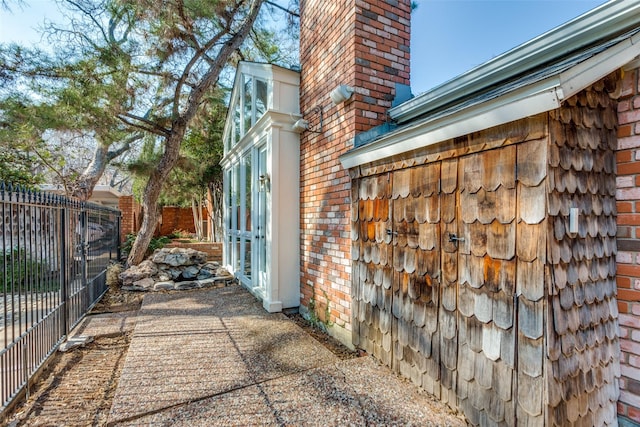 view of side of property with a patio area