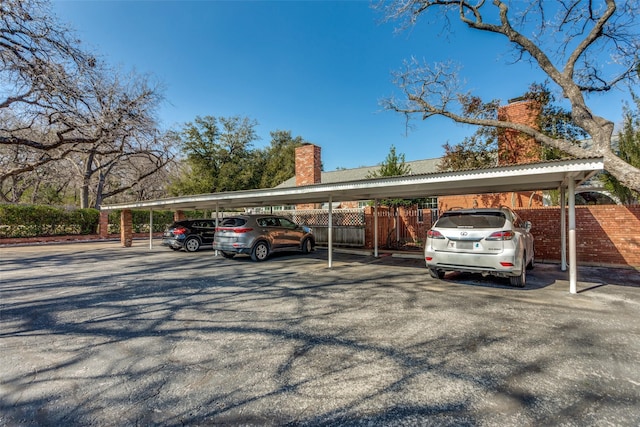 view of vehicle parking featuring a carport