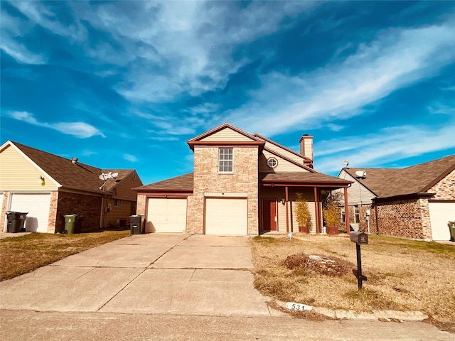 view of front facade with a garage and a front yard