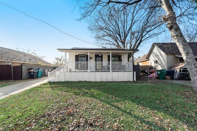 view of front of property with covered porch and a front lawn