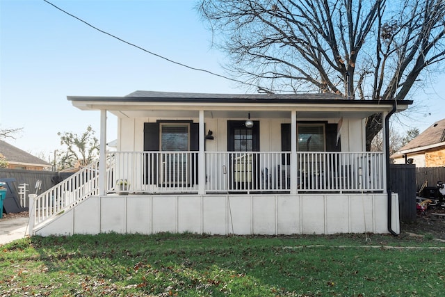 view of front of house featuring a front yard and covered porch