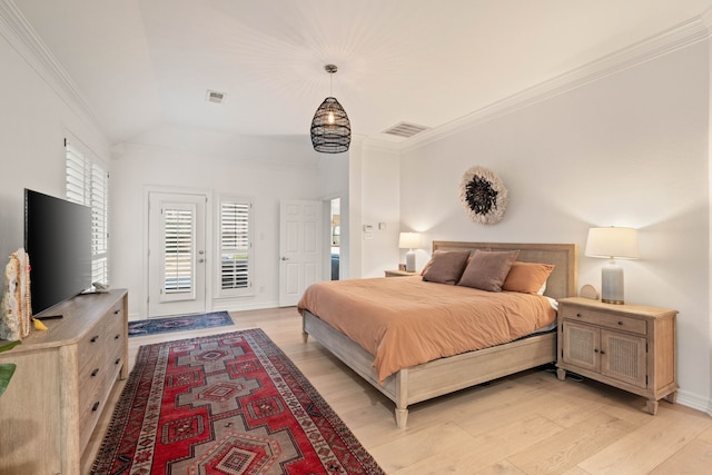 bedroom featuring access to exterior, crown molding, and light hardwood / wood-style flooring