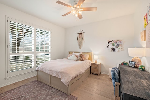 bedroom featuring ceiling fan and light hardwood / wood-style flooring