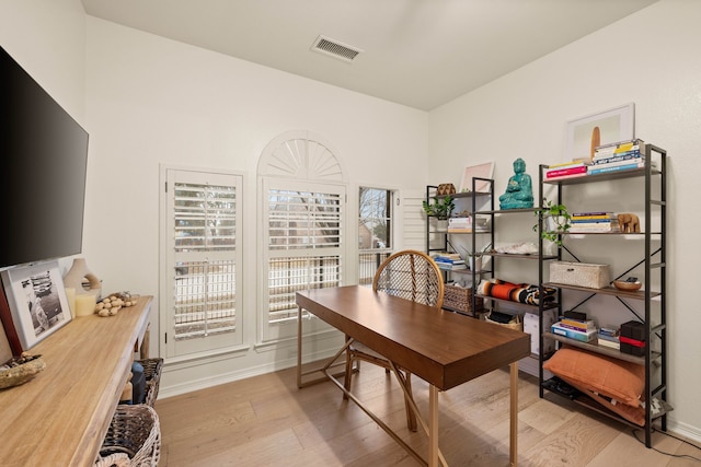 home office with light wood-type flooring