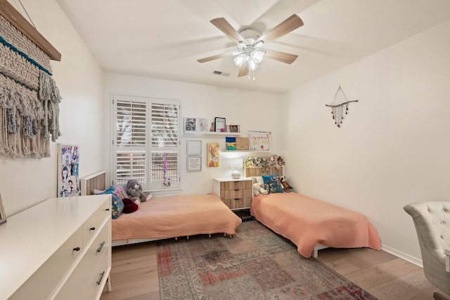 bedroom featuring ceiling fan and light hardwood / wood-style floors