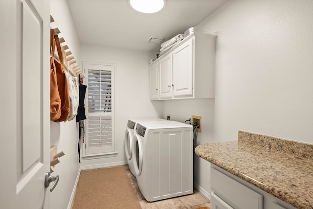 washroom with cabinets and independent washer and dryer