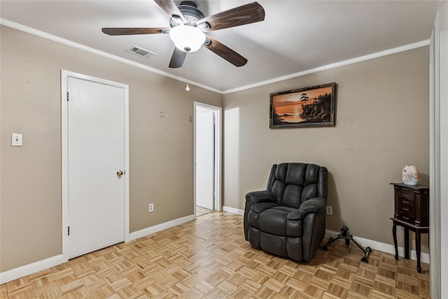 living area featuring ornamental molding, a ceiling fan, visible vents, and baseboards