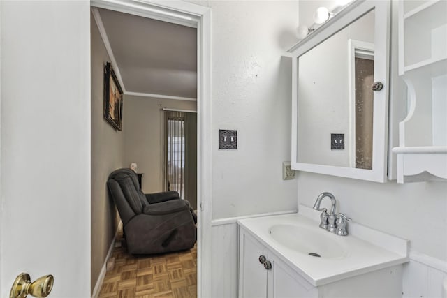 bathroom featuring vanity and crown molding