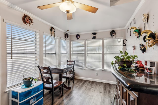 sunroom / solarium featuring a ceiling fan