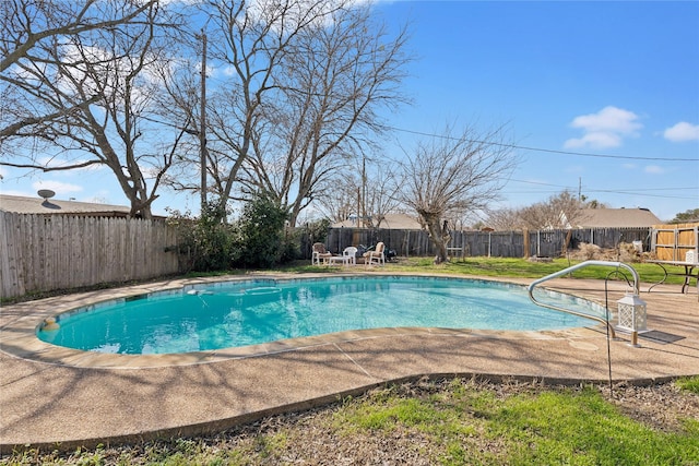 view of pool with a fenced in pool, a patio area, and a fenced backyard