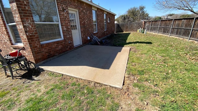 view of yard featuring a patio area and a fenced backyard