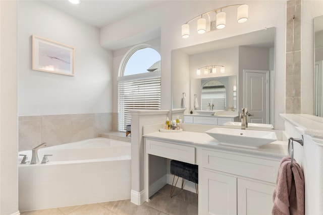 bathroom featuring vanity, tile patterned floors, and a bathing tub