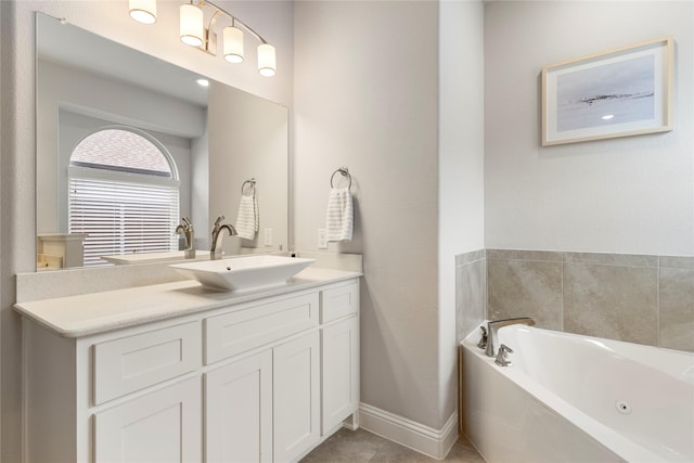 bathroom with vanity, tile patterned floors, and a tub