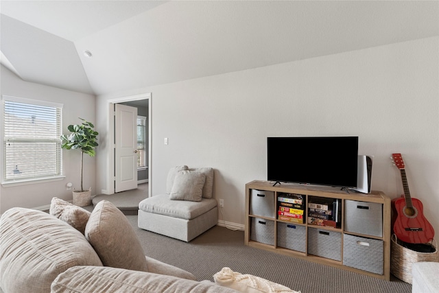 carpeted living room with vaulted ceiling