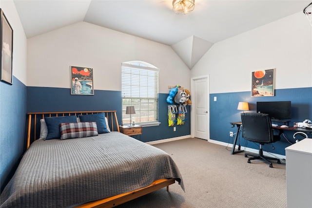 carpeted bedroom featuring lofted ceiling