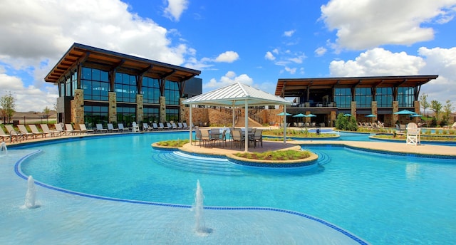 view of pool with a gazebo and pool water feature