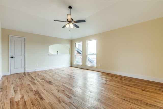 empty room featuring ceiling fan and light wood-type flooring