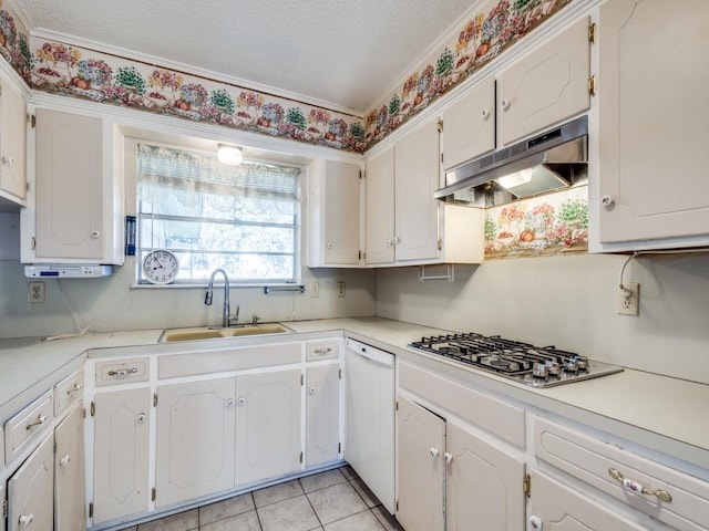 kitchen with stainless steel gas stovetop, sink, white cabinets, and white dishwasher