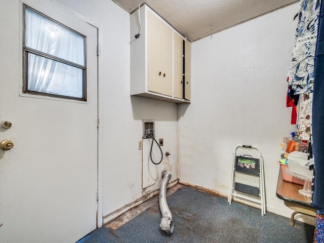 washroom featuring washer hookup and cabinets