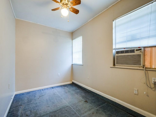 spare room with carpet flooring, cooling unit, and ceiling fan