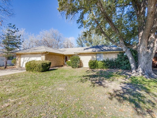 ranch-style house with a garage and a front yard