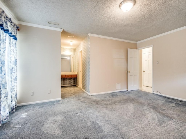 carpeted spare room with crown molding and a textured ceiling