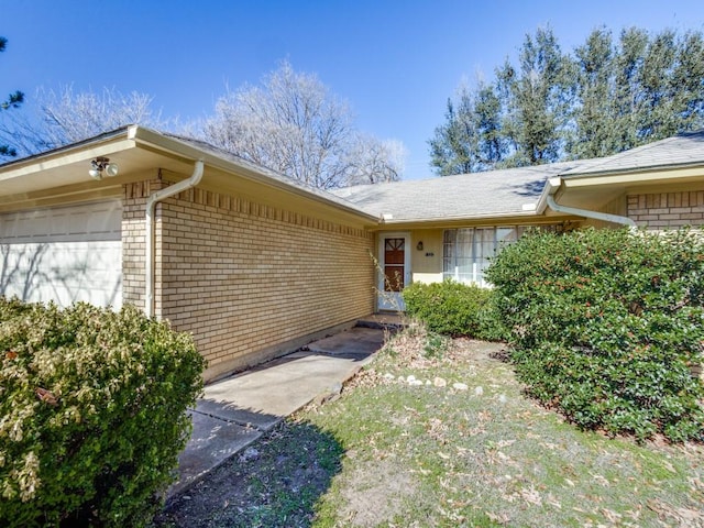 entrance to property featuring a garage