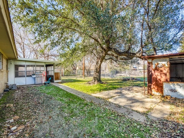 view of yard featuring a sunroom