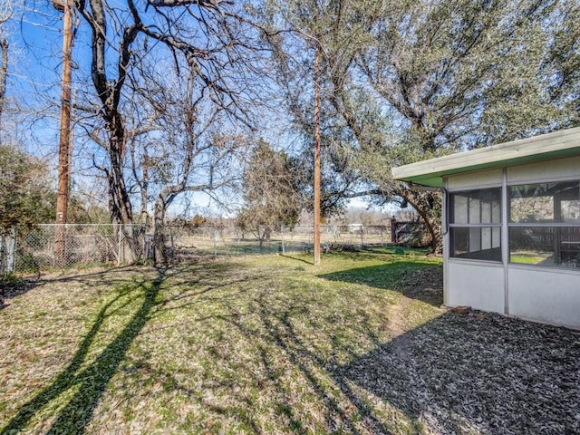 view of yard with a sunroom