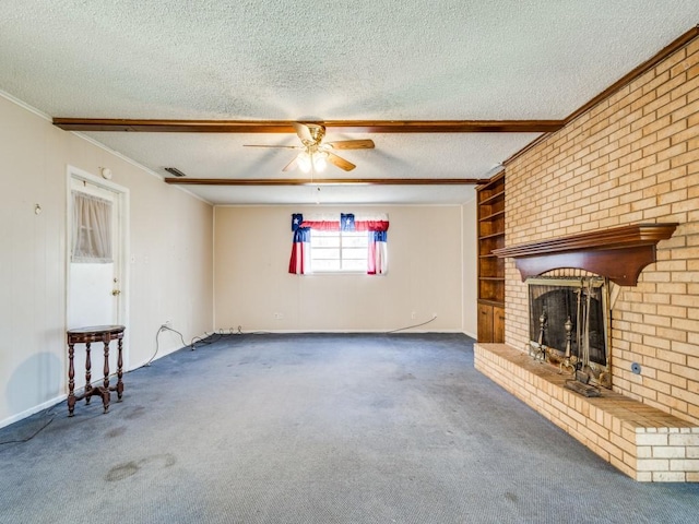 unfurnished living room with dark carpet, ceiling fan, crown molding, a brick fireplace, and a textured ceiling