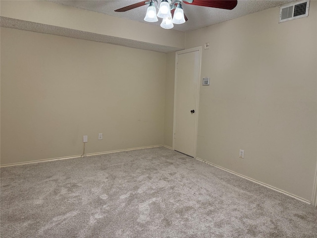 unfurnished room featuring ceiling fan, a textured ceiling, and carpet flooring