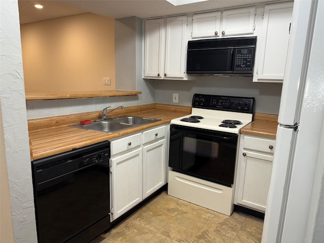 kitchen featuring white cabinetry, sink, and black appliances