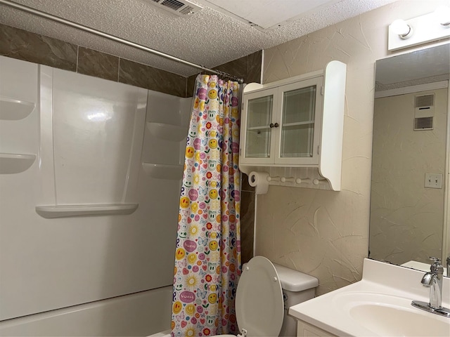 full bathroom with vanity, shower / bathtub combination with curtain, a textured ceiling, and toilet