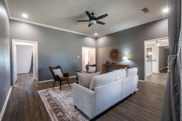 living room featuring ceiling fan, dark hardwood / wood-style flooring, and ornamental molding