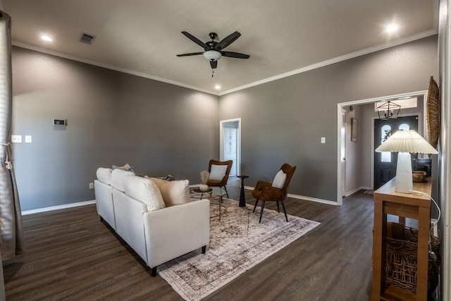 living room featuring ceiling fan, dark hardwood / wood-style flooring, and crown molding