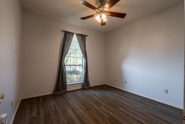 empty room with ceiling fan and dark hardwood / wood-style floors