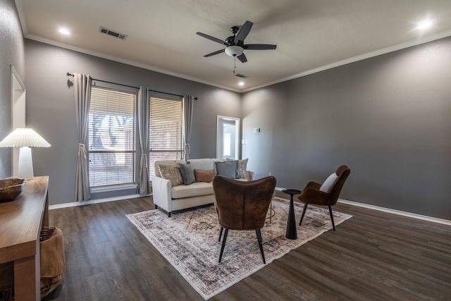 living room featuring ceiling fan, crown molding, and dark hardwood / wood-style floors